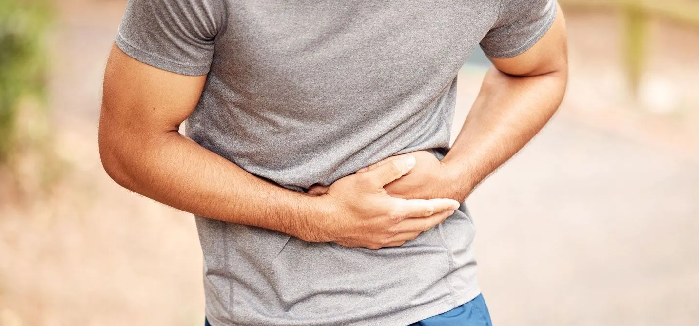 Man holding stomach in pain - Hernia